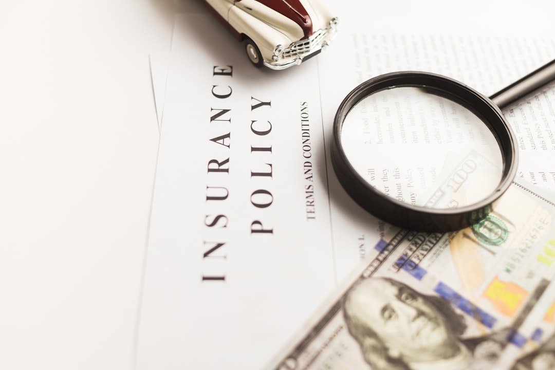 story-02 Certificate of motor insurance and policy with car and dollar bills.