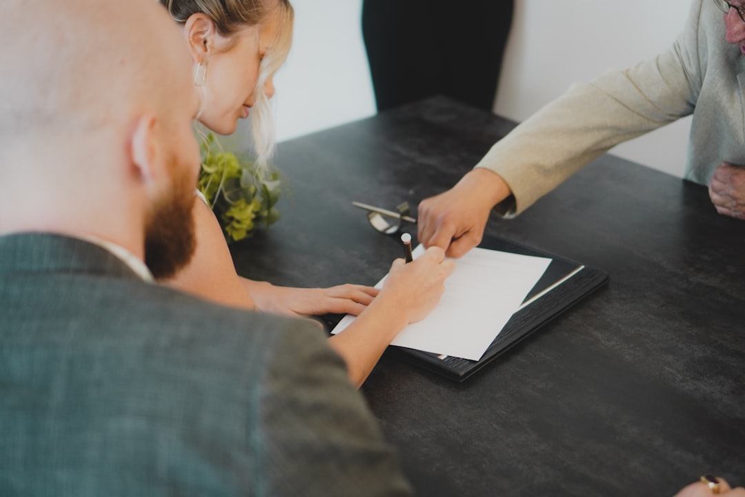 services-02 couple-signing-document-at-desk-wnxbeonug-4