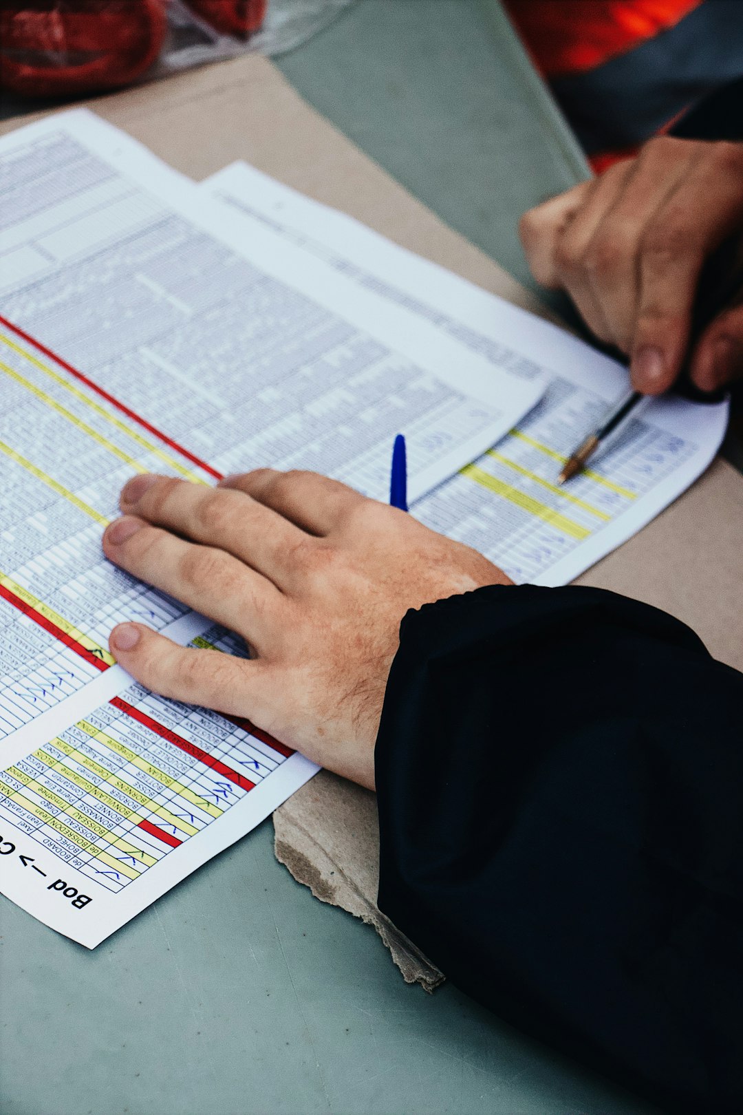 services-05 persons-hand-on-two-stack-of-paper-a7bbjzmdqk4